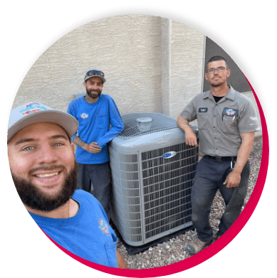 3 workers standing next to a new carrier unit