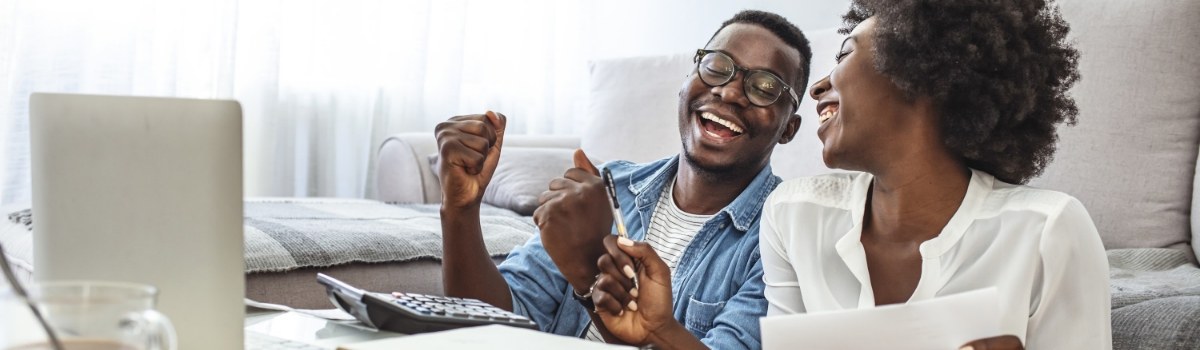 couple looking at laptop doing financing